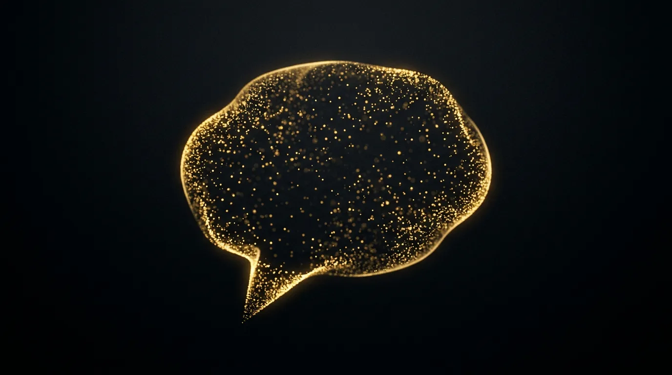 An abstract speech bubble formed from floating golden particles on black